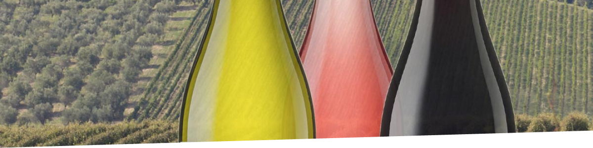 Three bottles of Ilauri wine on a background of vineyards